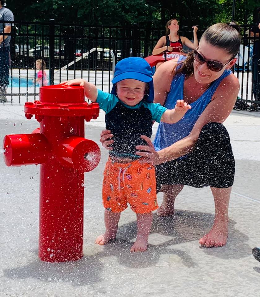 A refreshing dip in the city's pools: where families gather for summer fun.